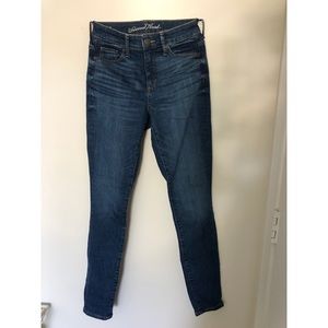 Medium/dark wash high rise straight/skinny jean